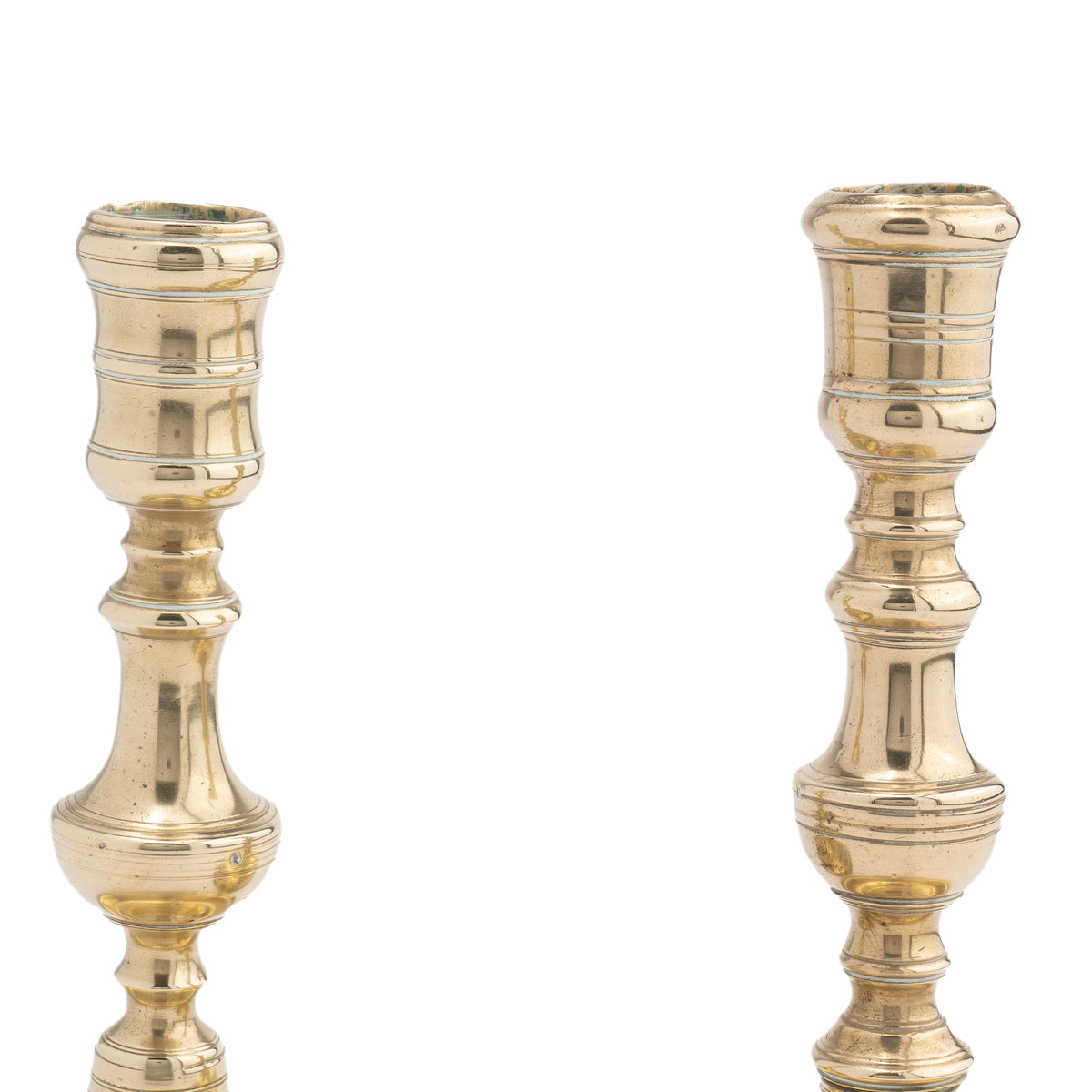 Assembled pair of French Louis XV cast brass chamber candlesticks, 1710-20