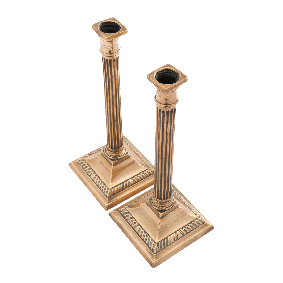 Pair of English cast bell metal candlesticks, 1790