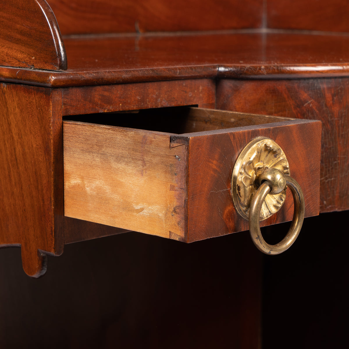 American mahogany demilune dressing stand on brass castors, 1830s